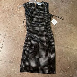 Never worn /Sheath Dress/ Stetchy/ Looks great on a date night or for work!